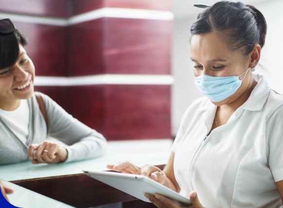 health worker using tablet